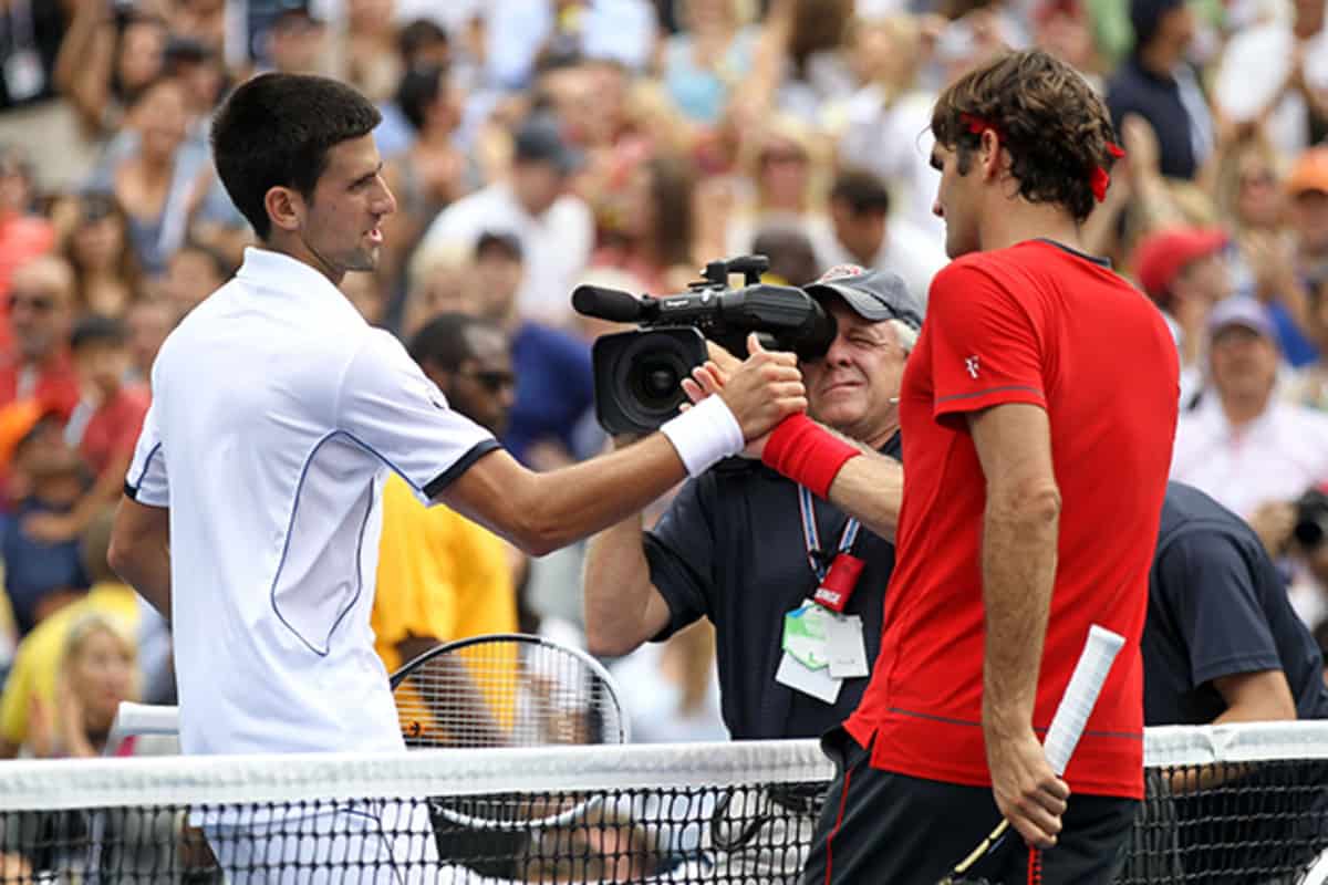 Roger Federer (R) of Switzerland congratulates Novak Djokovic of Serbia after Djokovic won their match during Day Thirteen of the 2011 US Open at the USTA Billie Jean King National Tennis Center on September 10, 2011