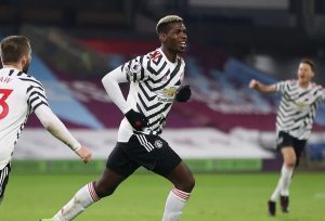 Paul Pogba celebrates with Luke Shaw after scoring his side's opening goal