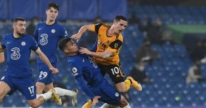 Daniel Podence collides with Chelsea defender Thiago Silva