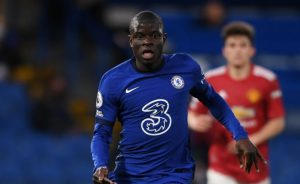 N'Golo Kante of Chelsea runs with the ball whilst under pressure from Scott McTominay of Manchester United during the Premier League match between Chelsea and Manchester United at Stamford Bridge on February 28, 2021 in London, England. Sporting stadiums around the UK remain under strict restrictions due to the Coronavirus Pandemic as Government social distancing laws prohibit fans inside venues resulting in games being played behind closed doors. (Photo by Harriet Lander - Chelsea FC/Chelsea FC via Getty Images)