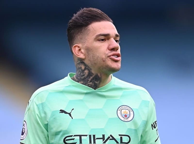 Ederson of Manchester City loos on during the Premier League match between Manchester City and Manchester United at Etihad Stadium on March 07, 2021 in Manchester, England. Sporting stadiums around the UK remain under strict restrictions due to the Coronavirus Pandemic as Government social distancing laws prohibit fans inside venues resulting in games being played behind closed doors. (Photo by Laurence Griffiths/Getty Images)