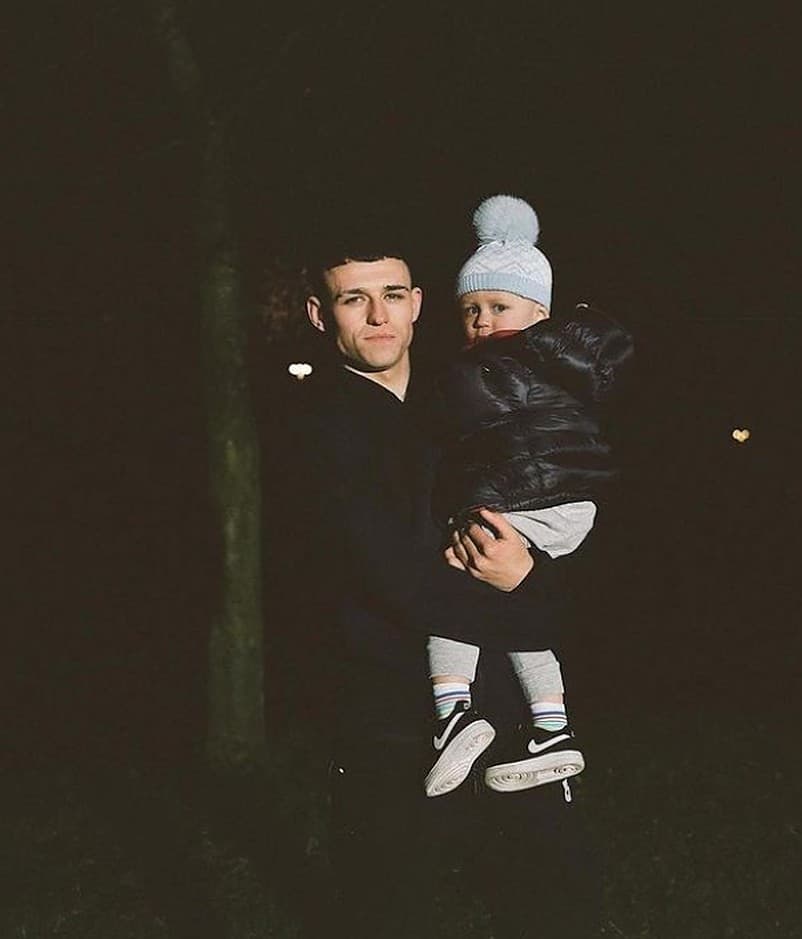 Phil Foden with his son