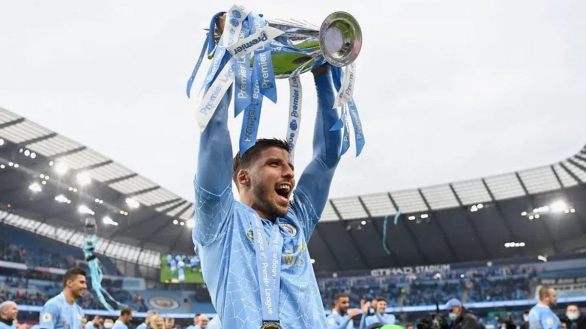 Ruben Dias with a Premier League trophy